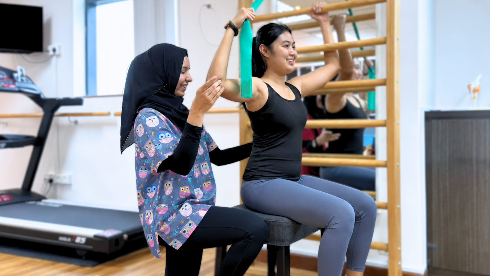WACC physiotherapist guiding a patient through a resistance exercise