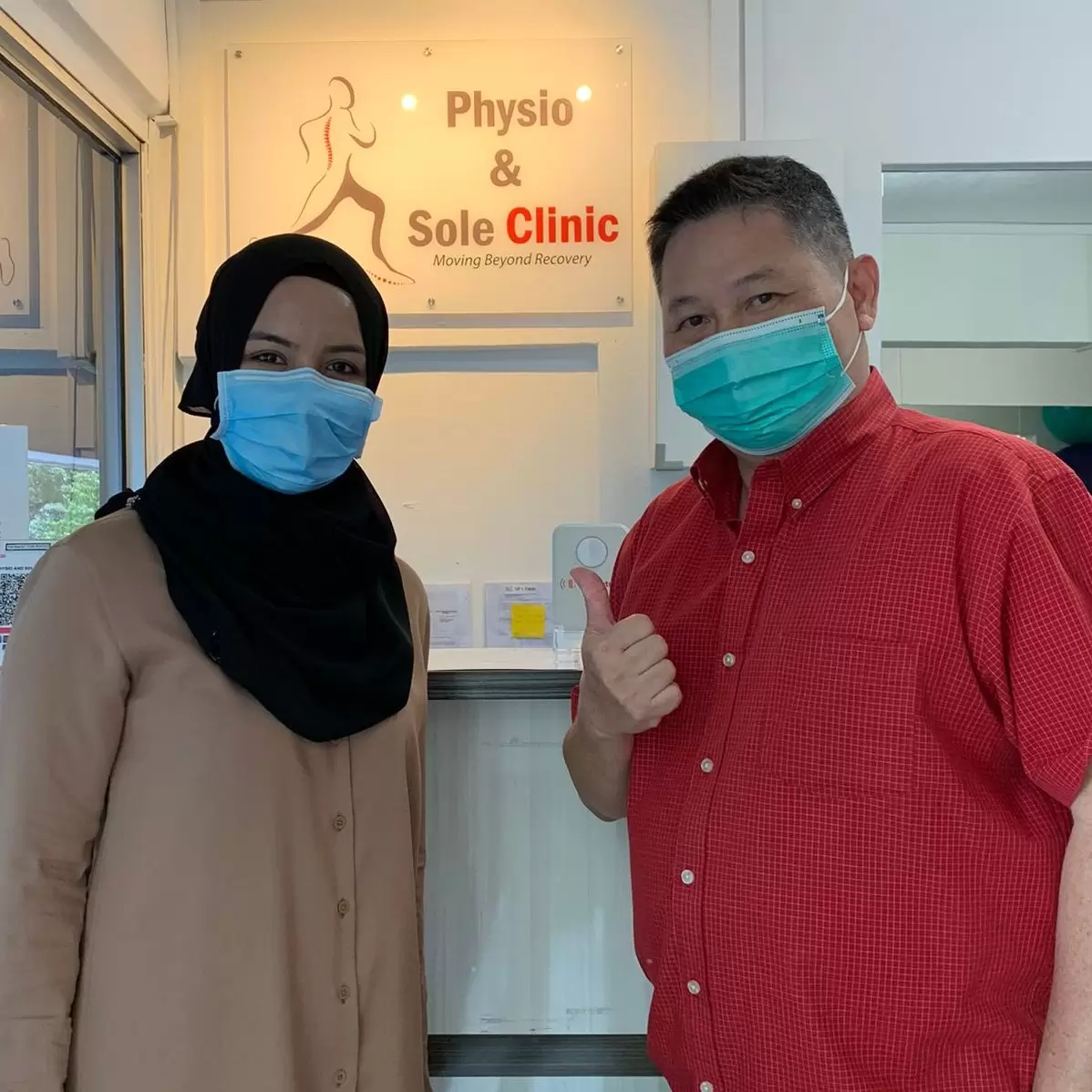 John Yong with their clinician at Physio & Sole Clinic