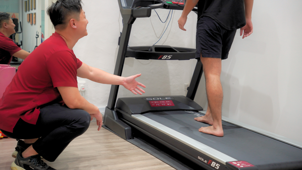 Podiatrist conducting gait analysis on a child to diagnose heel pain in kids caused by growth-related conditions such as Sever’s disease.